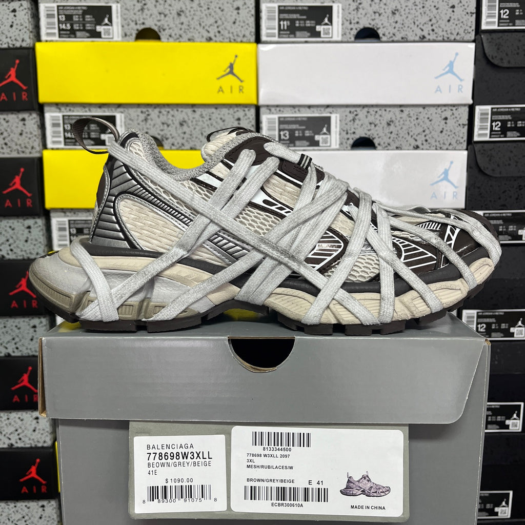 Unisex sneakers with light gray laces, textured upper, and black stripe accents