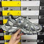 Balenciaga unisex sneakers, angled side view of grey knit upper with blue accents