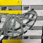 Balenciaga unisex sneakers, side view of grey mesh upper with blue tread and laces