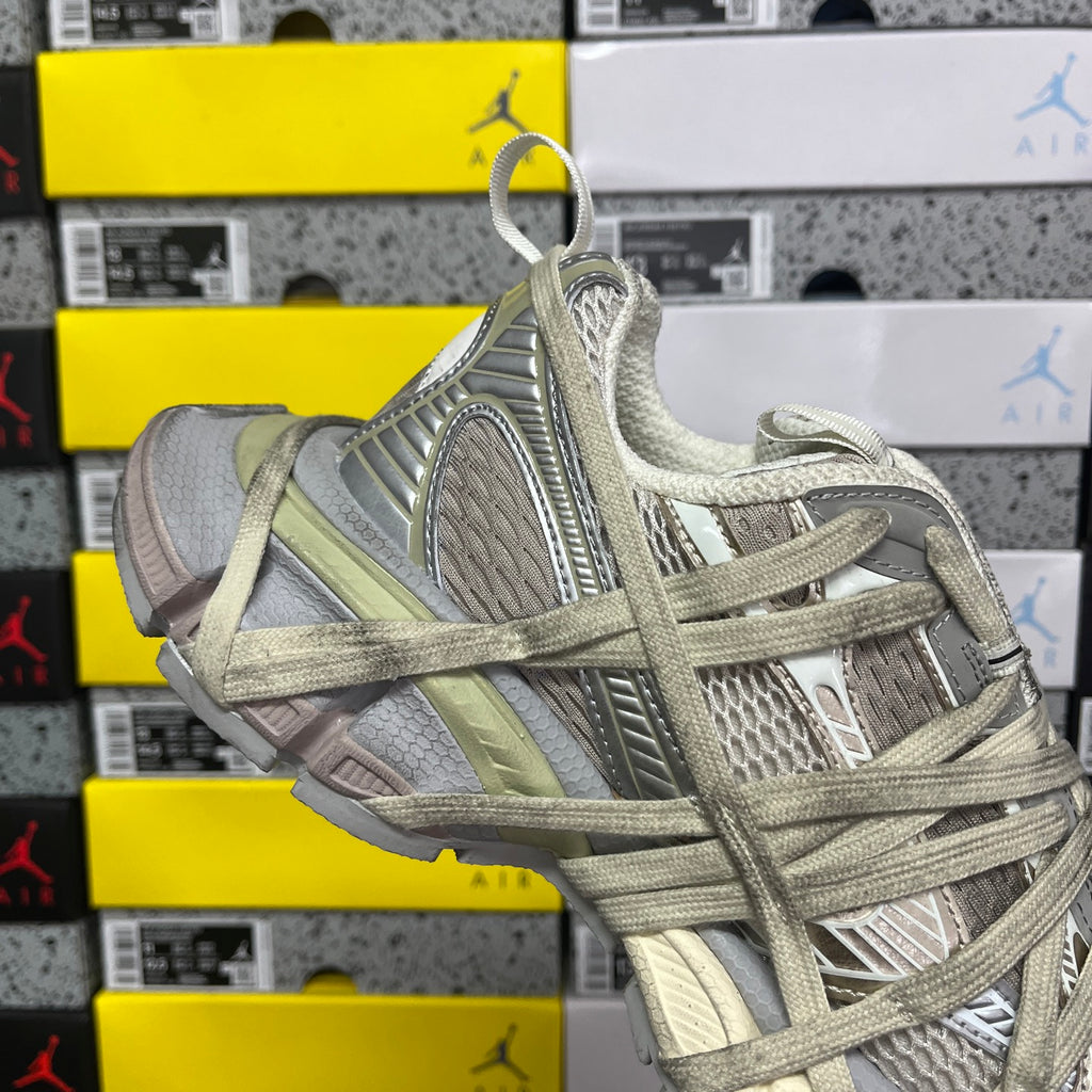 Balenciaga unisex lace-up running shoe with mesh upper and light olive trim, side view