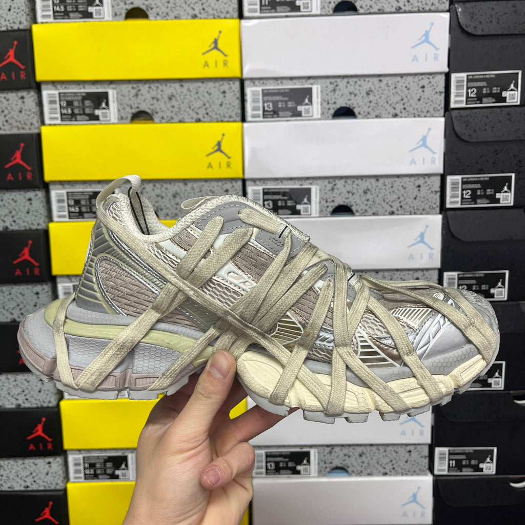 Balenciaga unisex lace-up running shoes in light olive and gray, front close-up
