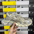 Balenciaga unisex lace-up running shoes in light olive and gray, front close-up