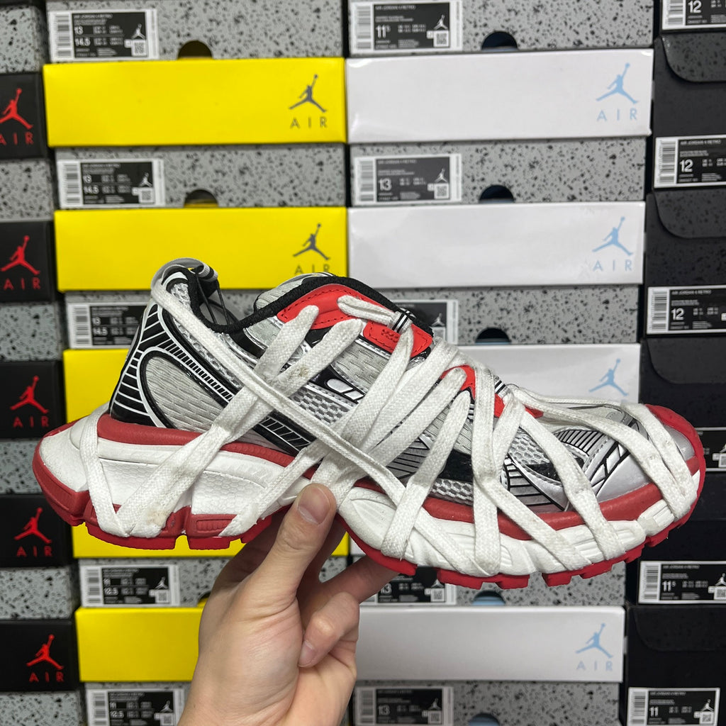 Balenciaga unisex sneakers front side view, white laces with red and gray accents