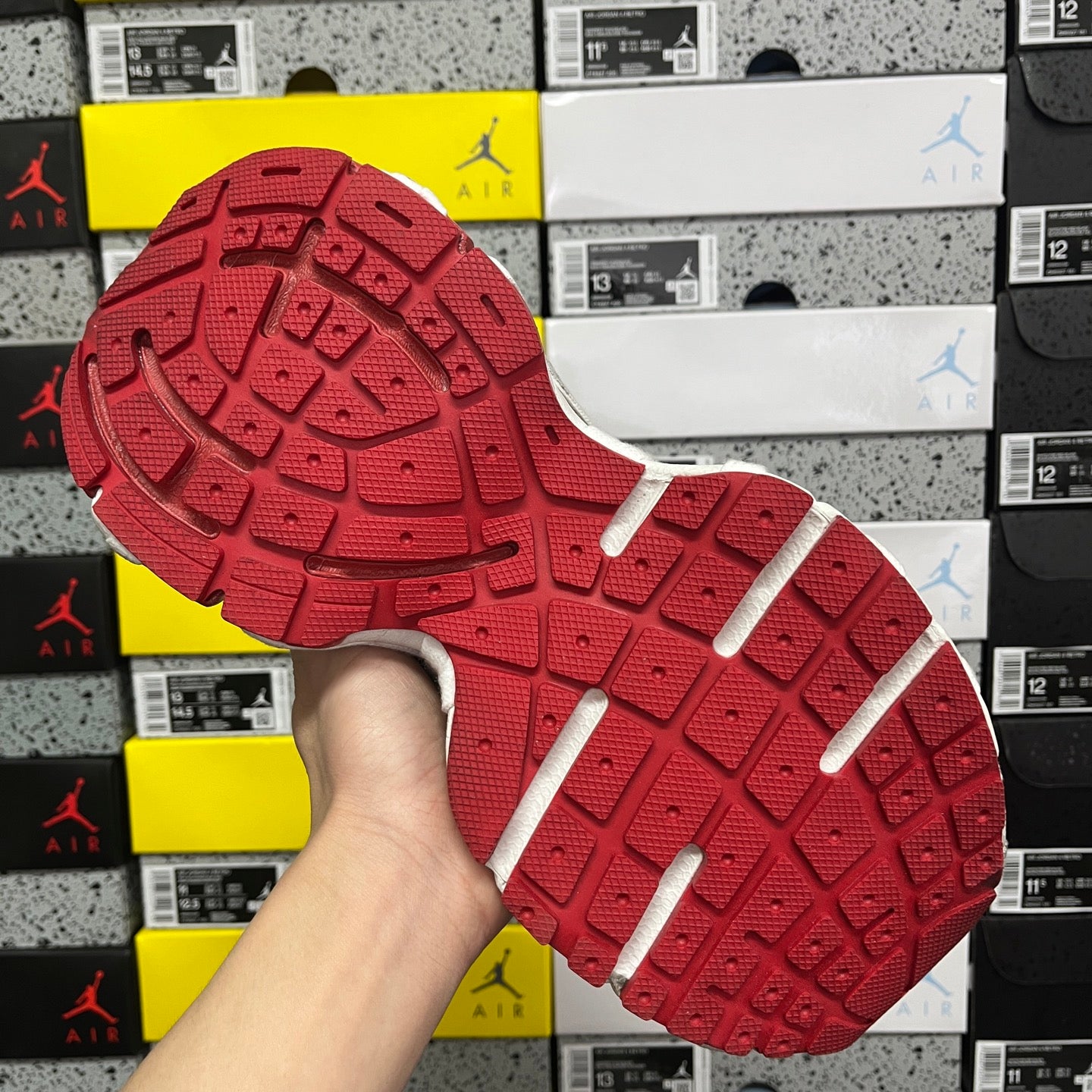 Balenciaga unisex sneakers outsole view, red rubber tread with white side strips