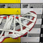 Balenciaga unisex sneakers angled side view, white mesh with red outsole trim