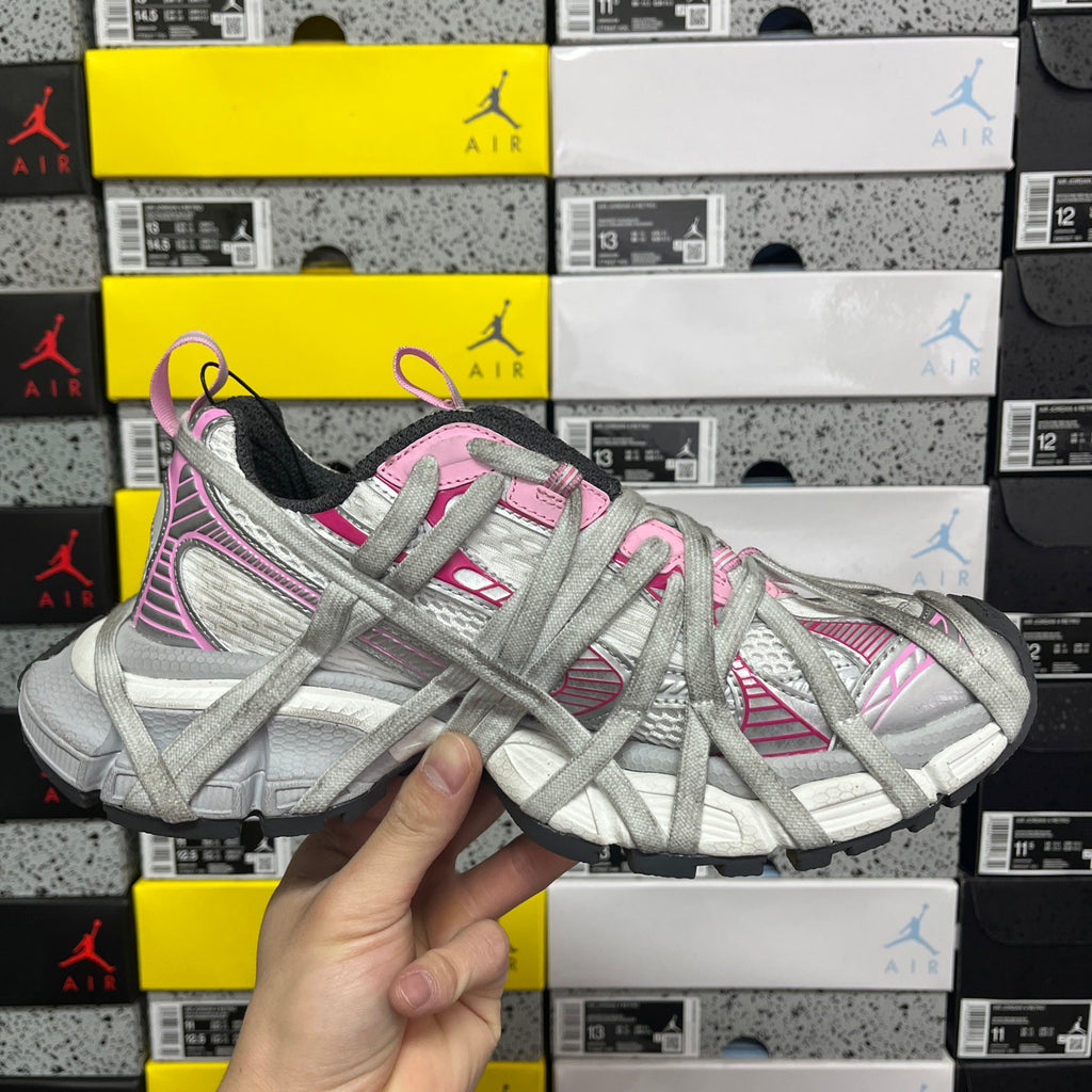 Light gray lace-up sneaker front view with pink laces and stripes
