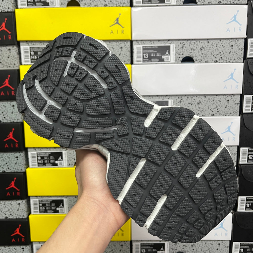 Black rubber outsole with light gray sidewall and deep tread