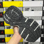 Black rubber outsole with light gray sidewall and deep tread