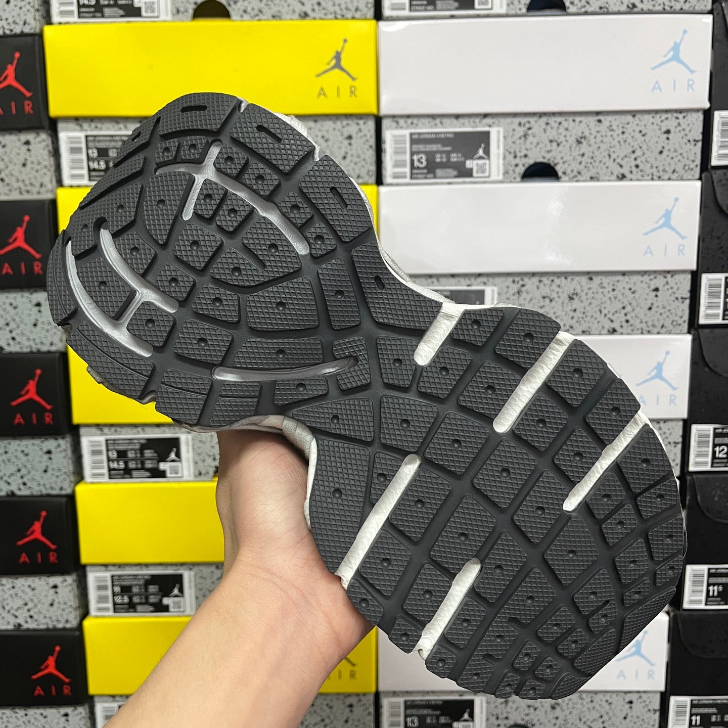 Black rubber outsole with light gray sidewall and deep tread