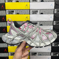 Light gray lace-up sneaker with pink accents and textured panels