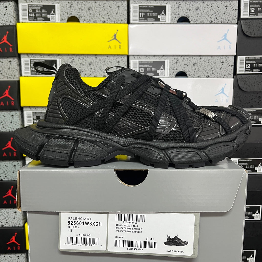 Balenciaga unisex black athletic shoes on white box, side view with chunky sole