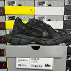 Balenciaga unisex black athletic shoes on white box, side view with chunky sole