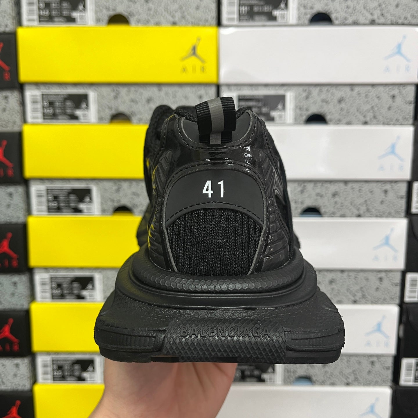 Balenciaga unisex black athletic shoes back view with size marking on heel tab