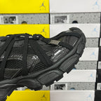 Balenciaga unisex black athletic shoes, close-up side with strap detail