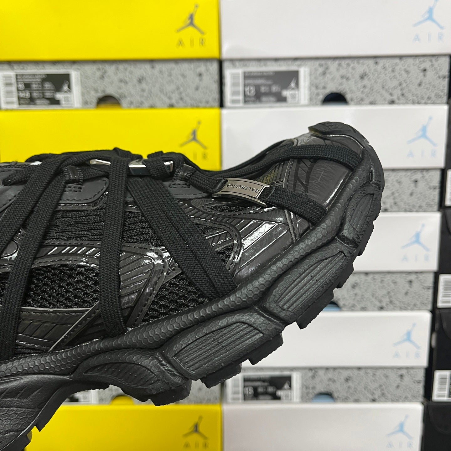 Balenciaga unisex black athletic shoes, close-up side with strap detail