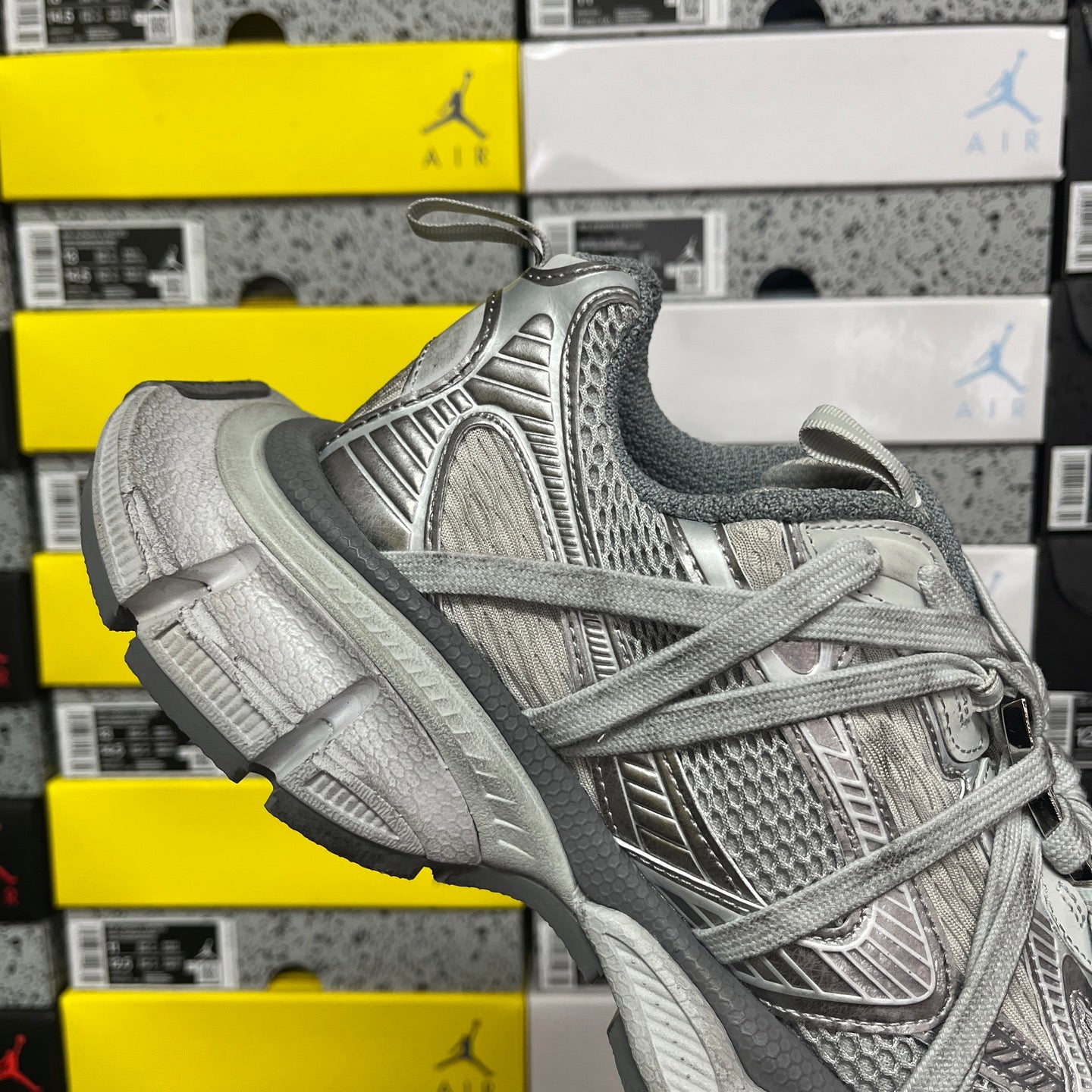 Gray knit low-top sneaker with lace-up closure and oversized treaded sole