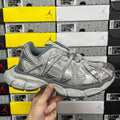 Gray knit mesh sneaker with lace-up front and thick cushioned sole