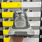 Gray sneaker tongue and heel with stitch detailing and rounded toe cap