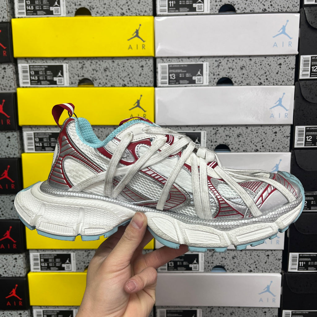 Lace-up sneakers in white with red striped panels and light blue accents