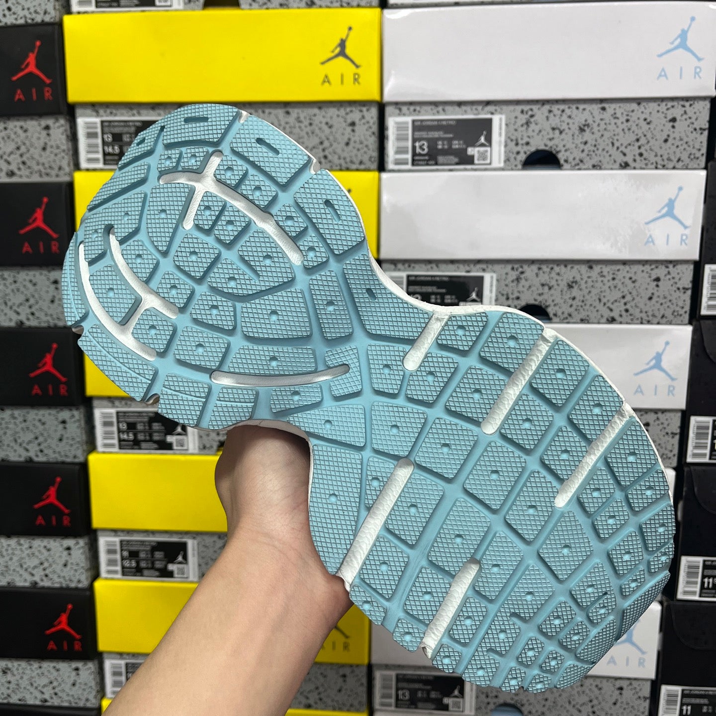 Light blue rubber outsole with grid tread pattern for traction