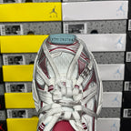 Back view of white lace-up sneaker with red panel stripes and light blue heel lining