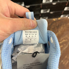 Blue sneaker tongue tag labeled BALENCIAGA, size 41, inside packaging tissue