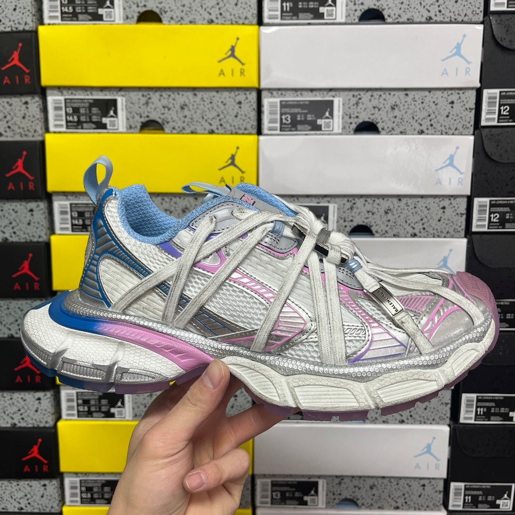 Multicolor lace-up sneaker with blue knit panels, pink stripes, and silver mesh toe cap