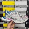 Multicolor lace-up sneaker with blue knit panels, pink stripes, and silver mesh toe cap
