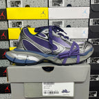 Sneakers in silver, purple, and blue with purple laces and textured side detail