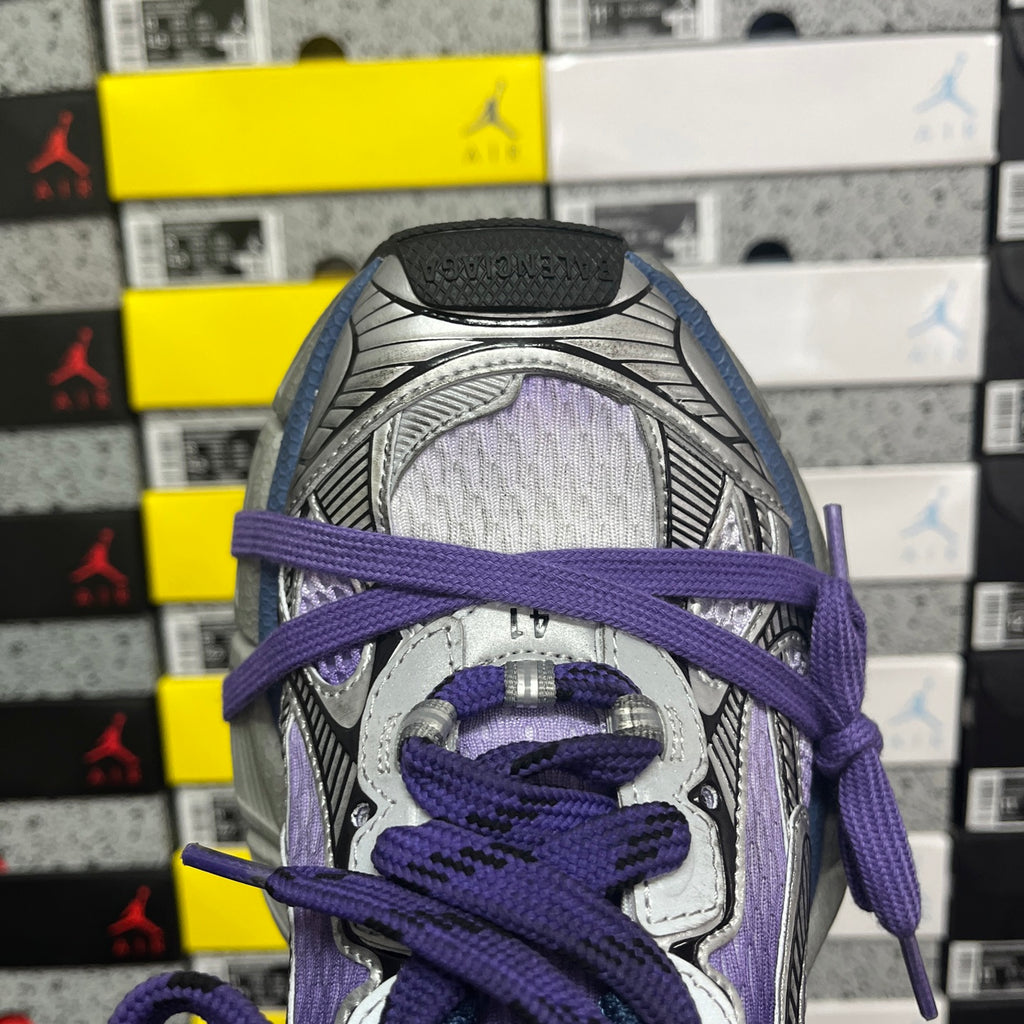 Sneakers tongue and lacing close-up in purple and gray with padded collar