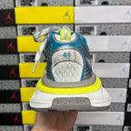 Unisex sneaker heel with molded white logo patch, blue mesh upper, neon yellow sole