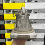 Gray lace-up sneaker heel with embossed heel tab and padded collar