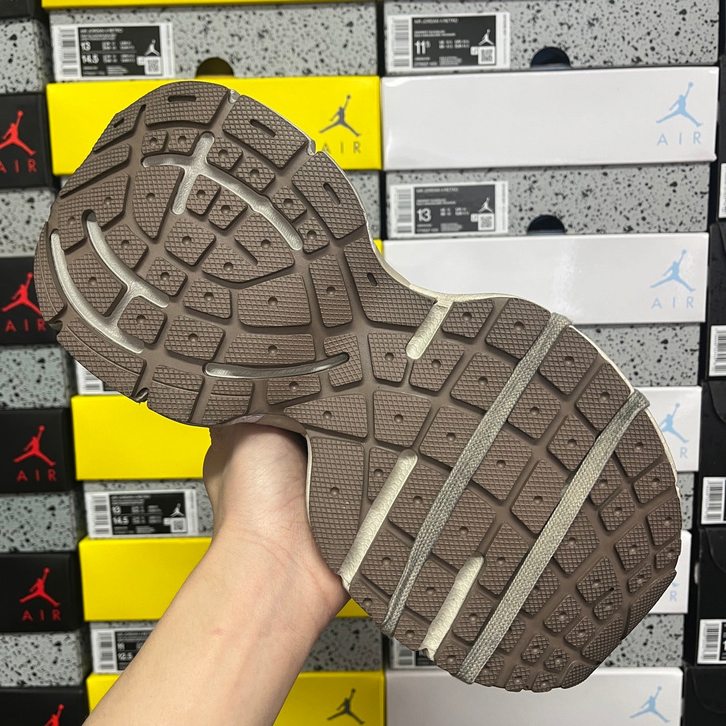 Gray sneaker outsole with traction tread pattern and textured rubber forefoot
