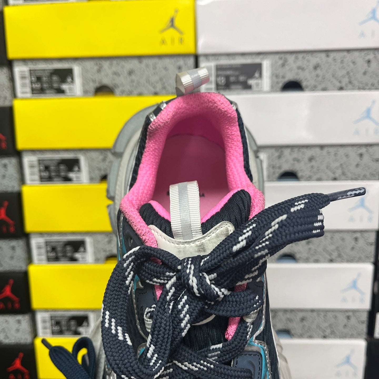 Unisex running shoe tongue and laces with pink lining and navy textured upper