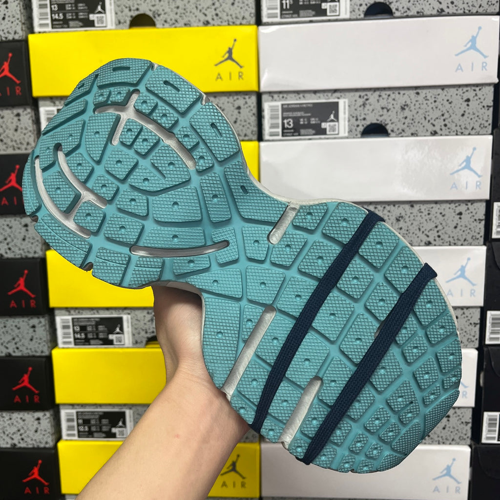 Unisex running shoe outsole in teal with dark tread lines