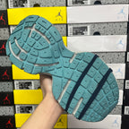 Unisex running shoe outsole in teal with dark tread lines