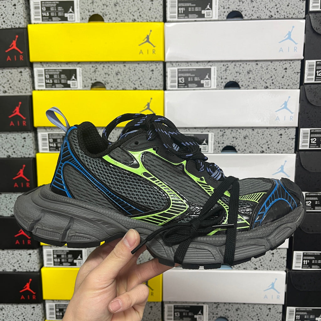 Black Balenciaga unisex running sneakers with neon green trim and blue accents