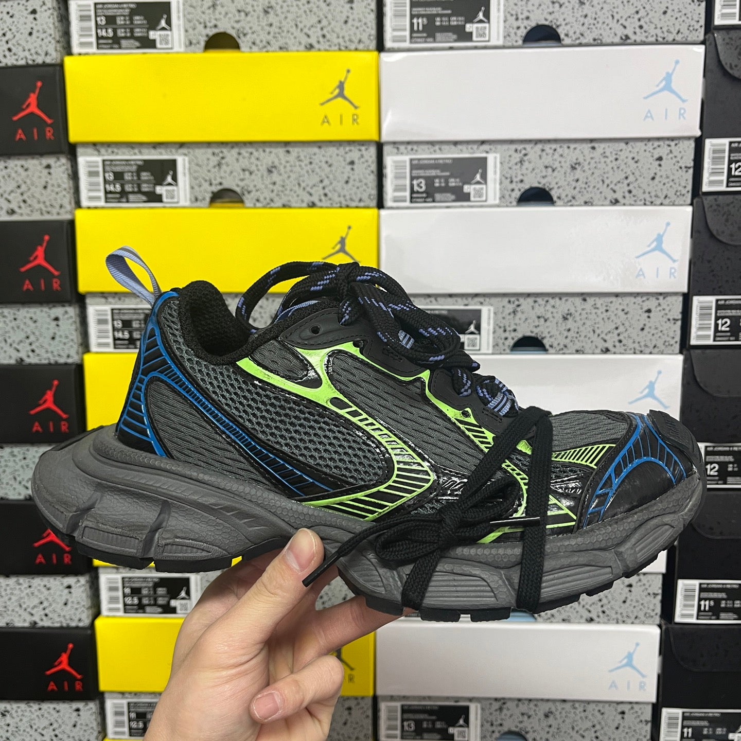 Black Balenciaga unisex running sneakers with neon green trim and blue accents