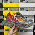 Low-top sneakers with red mesh panels, gray leather, and gray laces