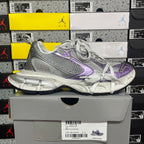 Unisex running shoe angled side view, silver knit mesh with purple side logo and laces