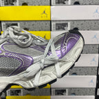 Unisex running shoe side view, silver upper with purple trim and white laces