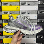 Unisex running shoe front view, silver mesh with purple logos and white laces