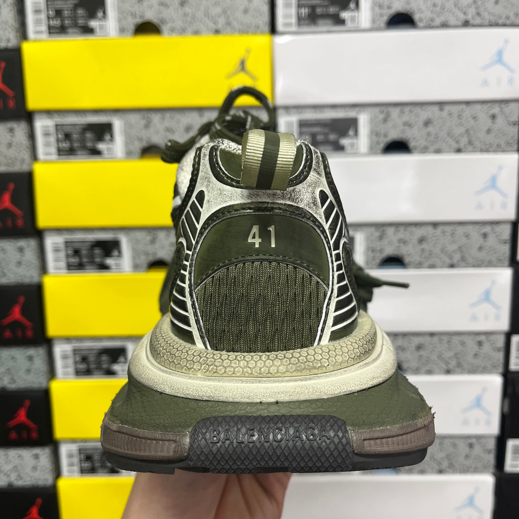 Green sneaker heel view with BALENCIAGA branding on the heel panel