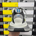Black-and-silver sneaker heel with treaded outsole, white midsole and lime accents.
