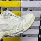 Balenciaga unisex sneakers angled toe and side, white upper with lace-up front