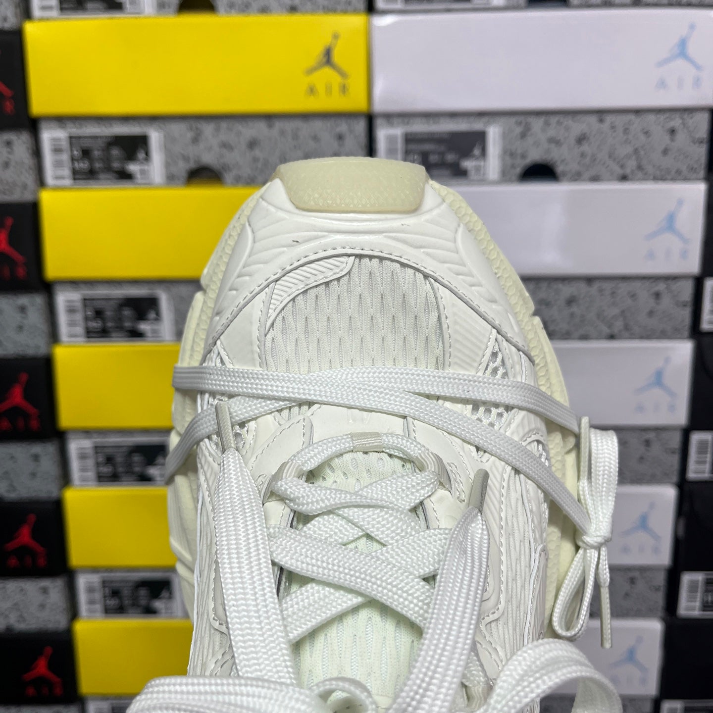 Balenciaga unisex sneakers close-up of tongue and laces, white textured upper