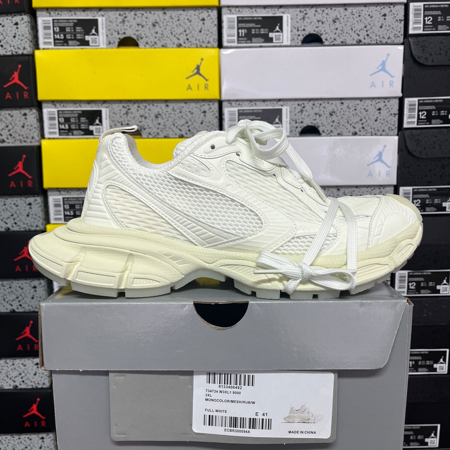 Balenciaga unisex sneakers side view, white upper and laces, thick rubber sole