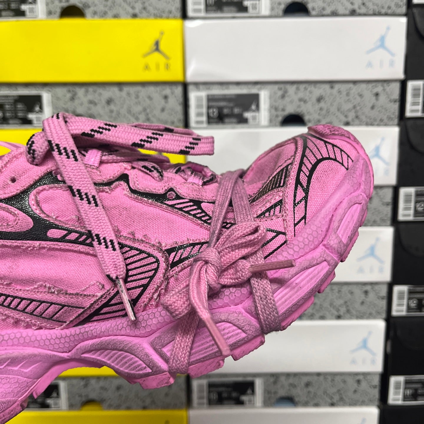 Pink Balenciaga unisex sneaker, angled side view showing woven upper and laces