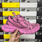 Pink Balenciaga unisex sneaker, top side view with logo panel and lace-up