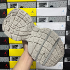 Light gray rubber outsole with square grid tread pattern, sneaker bottom
